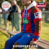Newcastle Knights 2026 red blue hoodie and jogger sports set featuring team branding, sponsor logos, and brown accents.