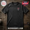 Black athletic jersey with embossed wolf motifs, Thor's hammer icons, and a Norway national soccer badge on wooden background.!
