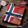 Red and blue Norwegian flag jersey featuring a Viking head graphic, gold trim, and a Norge crest on rustic wood table.!