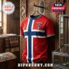 Red Norway soccer jersey with blue and white cross pattern, Norse knotwork embossing, and Norge crest on wooden background.!