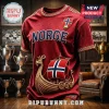 Maroon Norway soccer jersey with gold trim, NORGE text, a Norwegian flag shield, and a large Viking longship graphic.!