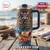One Piece 30th anniversary navy blue tumbler with gold relief, Straw Hat pirate ship design, and clear straw on a dock.!
