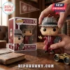 Paul Bear Bryant vinyl figure in a houndstooth fedora and crimson suit holding a play sheet, standing beside its box.!