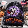 Peanuts Spooky Snoopy Tie-Dye Halloween Beanie Hat featuring a vampire Snoopy illustration on a black fabric background.