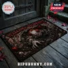 Pennywise Welcome To Derry Horror Movie Doormat featuring a sinister clown reaching out from dark, textured ruins.