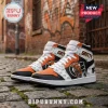 High-top leather sneakers featuring orange and black Philadelphia Flyers colors with Gritty mascot graphics on stone street.!