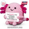 Crochet pink axolotl plush holding a white sign with text about being awesome, loved, and having got this.!