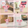 Pink crochet axolotl plush holding a sign that says Positive, I may be a tiny axolotl, but I believe in you.!