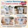 Light blue crocheted elephant doll holding a positive affirmation card on a desk, bookshelf, and bedside table background.!
