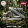 Custom green leather sneakers featuring Predator movie artwork and Yautja script on white rubber soles in a forest setting.!