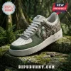 Custom green and white Predator themed leather sneaker with embossed scale texture on stone background.!
