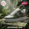 Custom green and white leather sneakers featuring Predator movie artwork on a mossy rock background.!