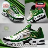 John Deere branded sneakers in white, green, and gold with Nothing Like A Deere text and white laces on grey background.!