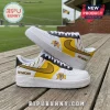 Richmond Tigers custom sneakers featuring yellow, black, and white leather with tiger logo and text on wood deck.!