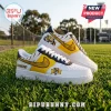 Richmond Tigers themed yellow, black, and white leather sneakers on green grass with team tiger head logos and lettering.!