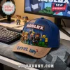 Blue and tan Roblox themed baseball cap featuring 3D figures and logo on a gaming desk setup.!