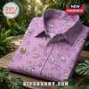 Lavender button-down shirt featuring a Rocko's Modern Life cartoon pattern with purple triangles on a wooden surface.!