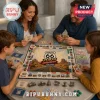 Family playing Route 66 100th Anniversary board game with metal tokens, colorful money, and map-themed game board on table.!