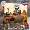 Route 66 100th Anniversary Monopoly game box with red car, diner, metal tokens, and dice on a grey surface.!
