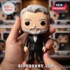 Vinyl bobblehead figure of an older man with gray hair and beard wearing a black suit jacket and white collared shirt.!