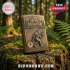 Antique brass Zippo-style lighter featuring a Sasquatch figure with a middle finger gesture on a mossy forest tree stump.!