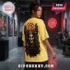Yellow t-shirt featuring Saw Billy the Puppet graphic, red spiral neon sign, and text reading Every choice has a cost.!