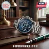 Seattle Mariners branded stainless steel chronograph watch with blue dial, diamond markers, and green accents on a desk.!