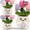 Crocheted potted flower figurine with pink and purple tulips and a white pot featuring a handwritten-style sentiment sign.!