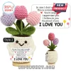 Crochet tulip plant in a white smiling pot holding a sentiment card with positive affirmations and the text I LOVE YOU.!