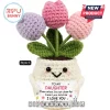 Crocheted cream flower pot with pink, purple, and light pink tulips holding a sign that says To My Daughter I Love You.!