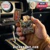 Gold Smokey and the Bandit 50th anniversary lighter featuring a black Pontiac Firebird and semi-truck in a car interior.!
