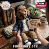 Crocheted Snoop Dogg amigurumi doll wearing a plaid shirt, gold chain, and sneakers, holding a sign stating emotional support.!