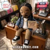 Crochet Snoop Dogg doll with braids, blue plaid shirt, and sneakers holding a sign saying Emotional Support Snoop.!