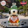 Crystal Snoopy figurine wearing a green ranger hat with a fleur-de-lis, engraved with 1950-2025 75th anniversary text.!