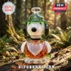Crystal Snoopy figurine wearing a green hat with a scout logo, featuring 1950-2025 75th anniversary text on a tree log.!