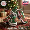 Snoopy Christmas sneakers with green and red patterns, white soles, and festive character graphics on a holiday rug.!