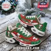 Snoopy Christmas sneakers with green and red patterns, white soles, and festive illustrations on a snowy wooden background.!