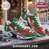 Snoopy Christmas themed sneakers with red and green pattern, white laces, and air-cushion soles on a snowy wooden porch.!