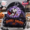 Snoopy Halloween 2026 Beanie Hat featuring a vampire Snoopy illustration, a purple moon, a castle, and orange text accents.