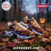 Snoopy Halloween sneakers with mummy and witch prints on orange, purple, and black fabric over white air-cushion soles.!