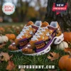 Orange and purple Halloween sneakers featuring Snoopy as a mummy and witch, white laces, and pumpkin graphics on grass.!