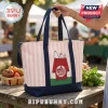 Pink and white striped canvas tote bag featuring Snoopy resting on a red Trader Joe's themed doghouse with navy handles.!
