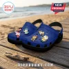 Blue foam clogs featuring Sonic the Hedgehog character charms on a wooden pier against a beach background.!