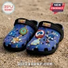 Blue Sonic the Hedgehog foam clogs with rubber charms of Tails, Chao, and game rings on a sandy beach background.!