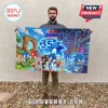 Man holding a rectangular Sonic the Hedgehog 35th anniversary wall banner featuring characters on a city and game background.!
