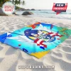 Sonic the Hedgehog 35th Anniversary rectangular beach towel on sand with blue, yellow, and red graphic design elements.!