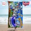 Sonic the Hedgehog 35th anniversary beach towel featuring various Sonic iterations and a purple race car on blue background.!
