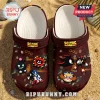 Sonic the Hedgehog anniversary foam clogs in dark maroon with Shadow the Hedgehog and Dr. Eggman PVC charms on sand.!