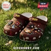 Brown Sonic the Hedgehog anniversary foam clogs with character charms on green grass, featuring text Sonic Anniversary.!