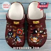 Maroon clog shoes featuring Shadow the Hedgehog graphics, Sonic anniversary logos, and assorted character charms.!